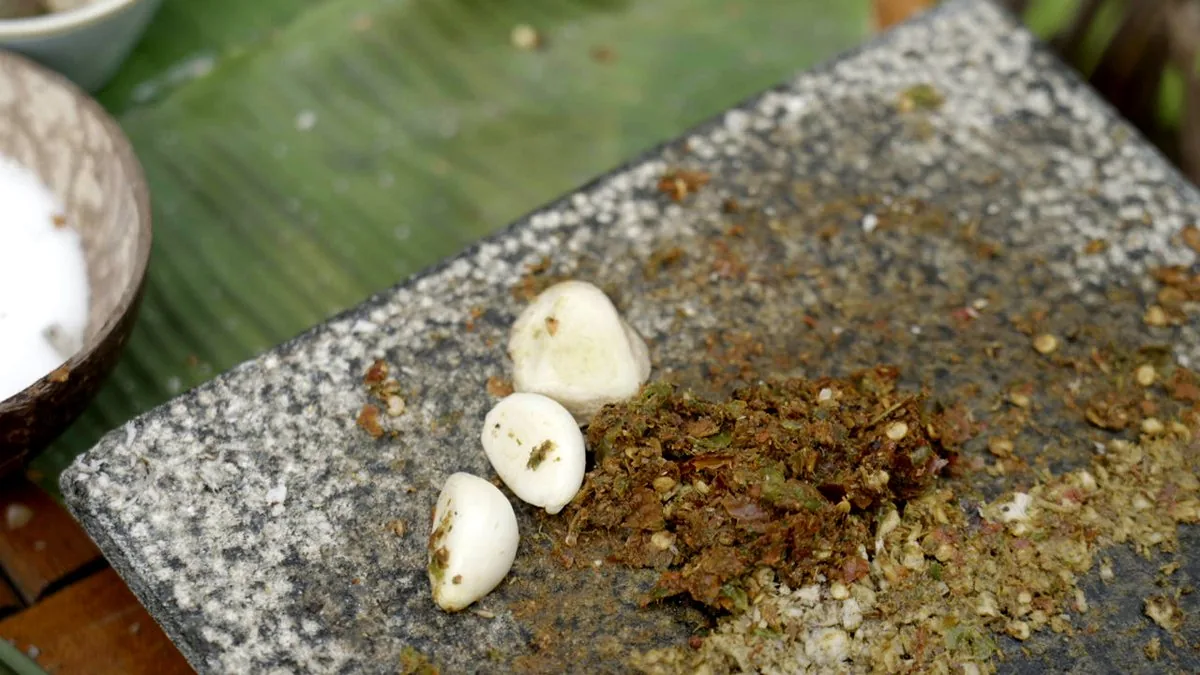 Garlic and ground spice on the grinding stone
