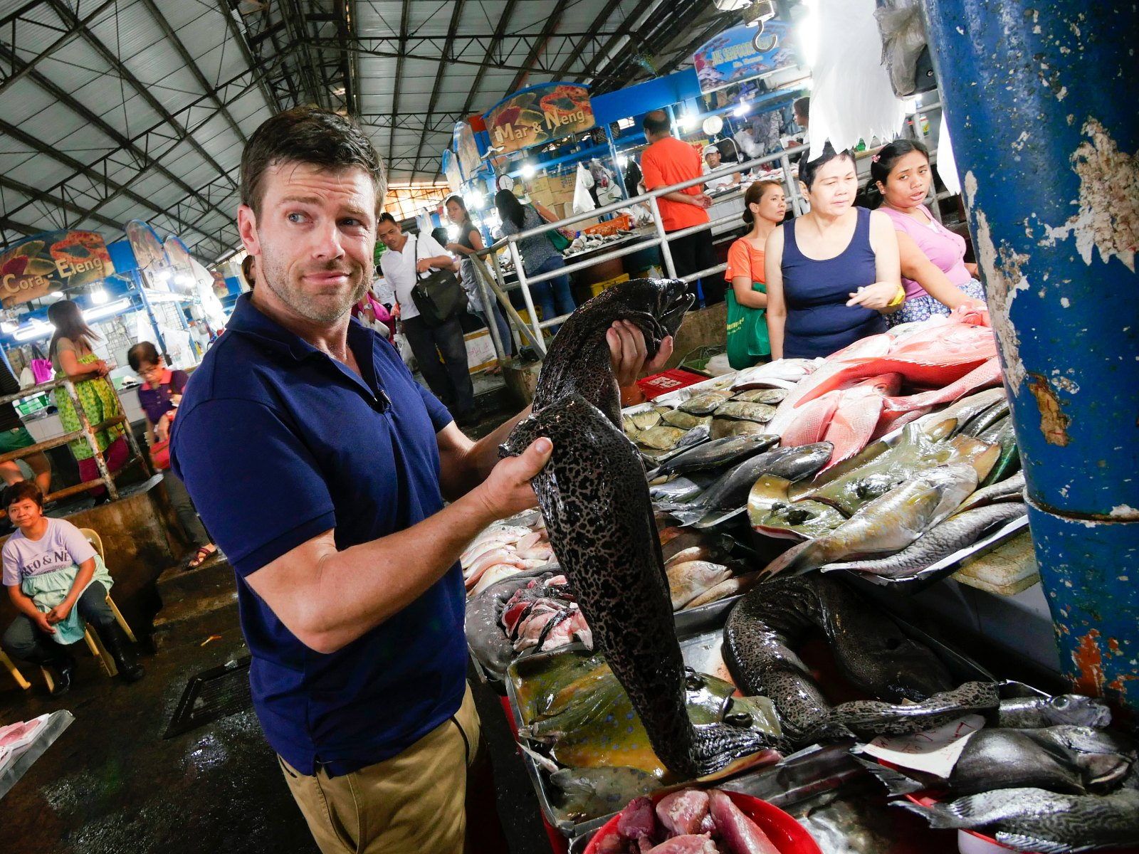 Jonathan Legg with a moray eel at a Philippine fish market