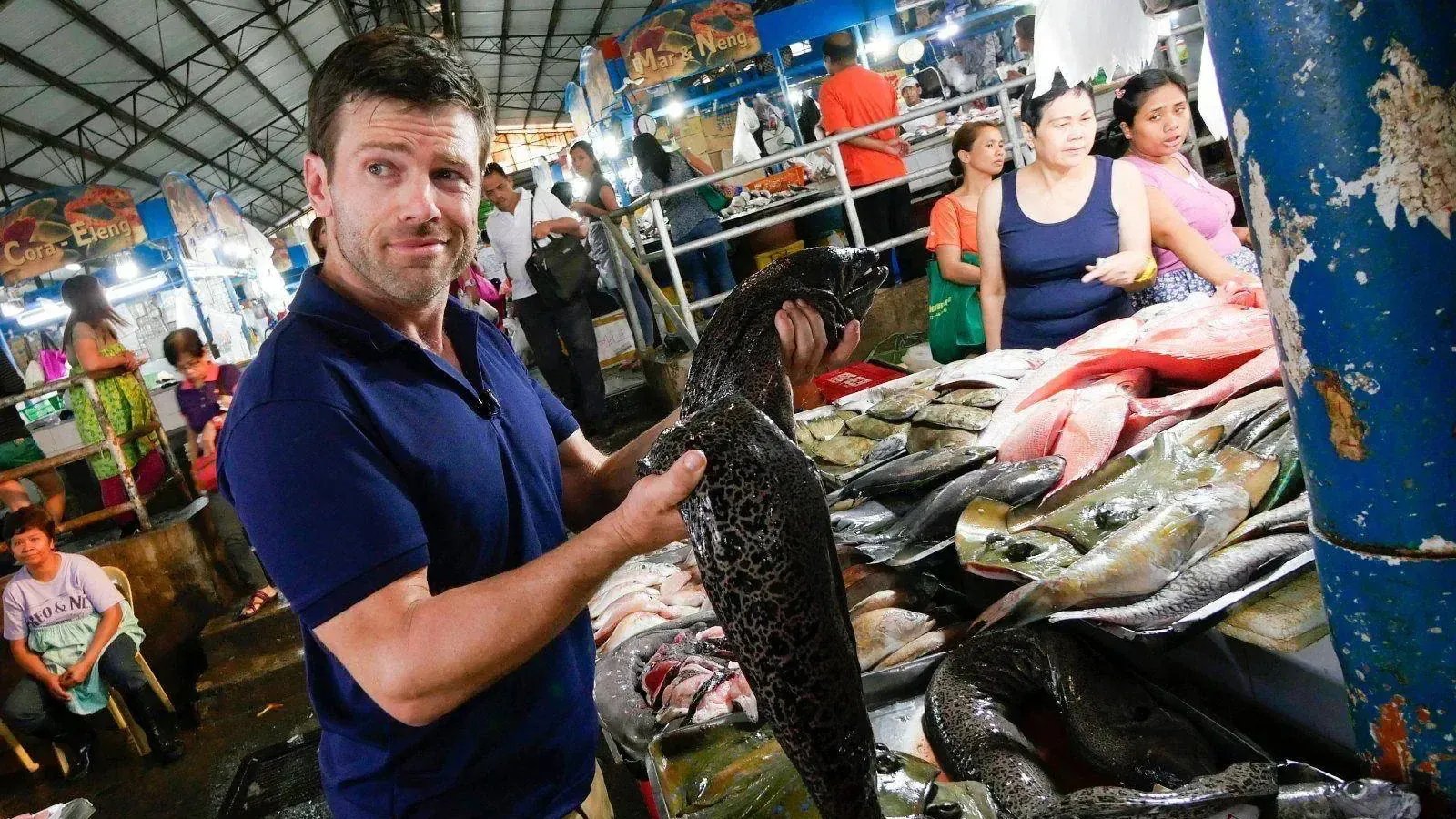 Jonathan Legg with a moray eel at a Philippine fish market