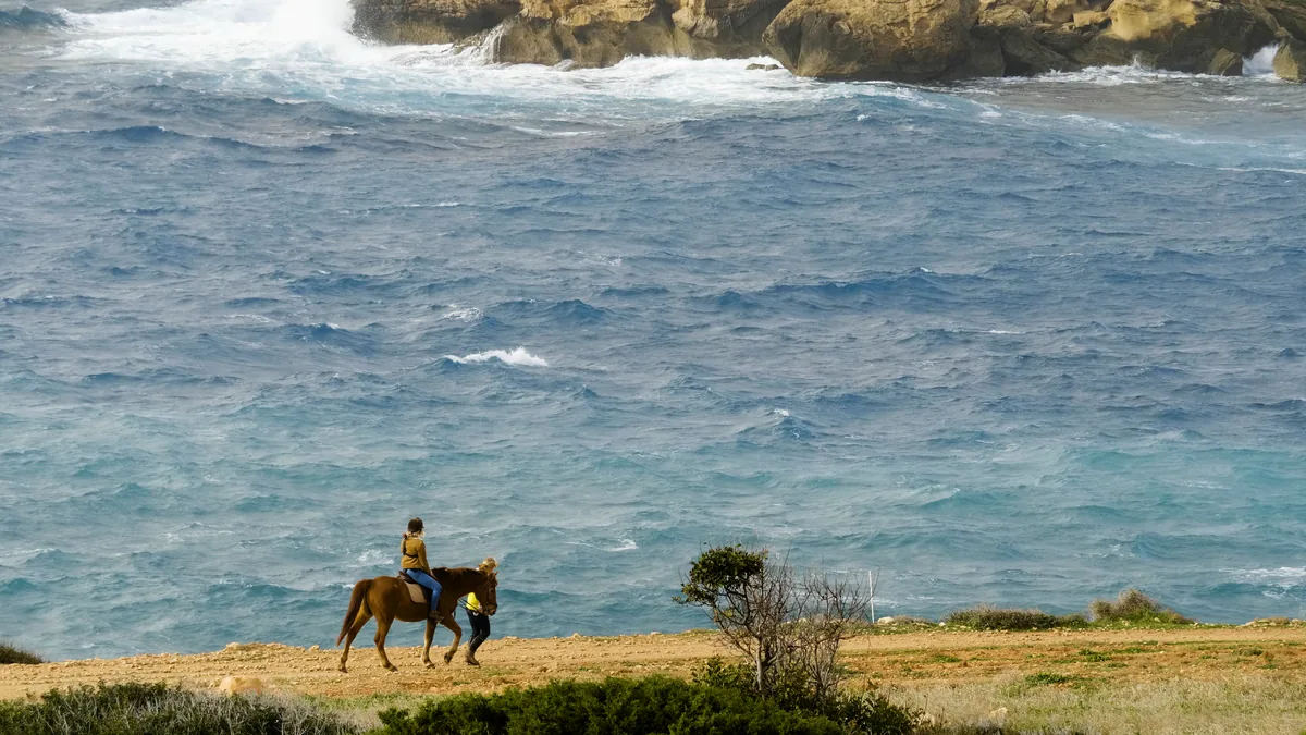 Riding the cliff path above the Mediterranean