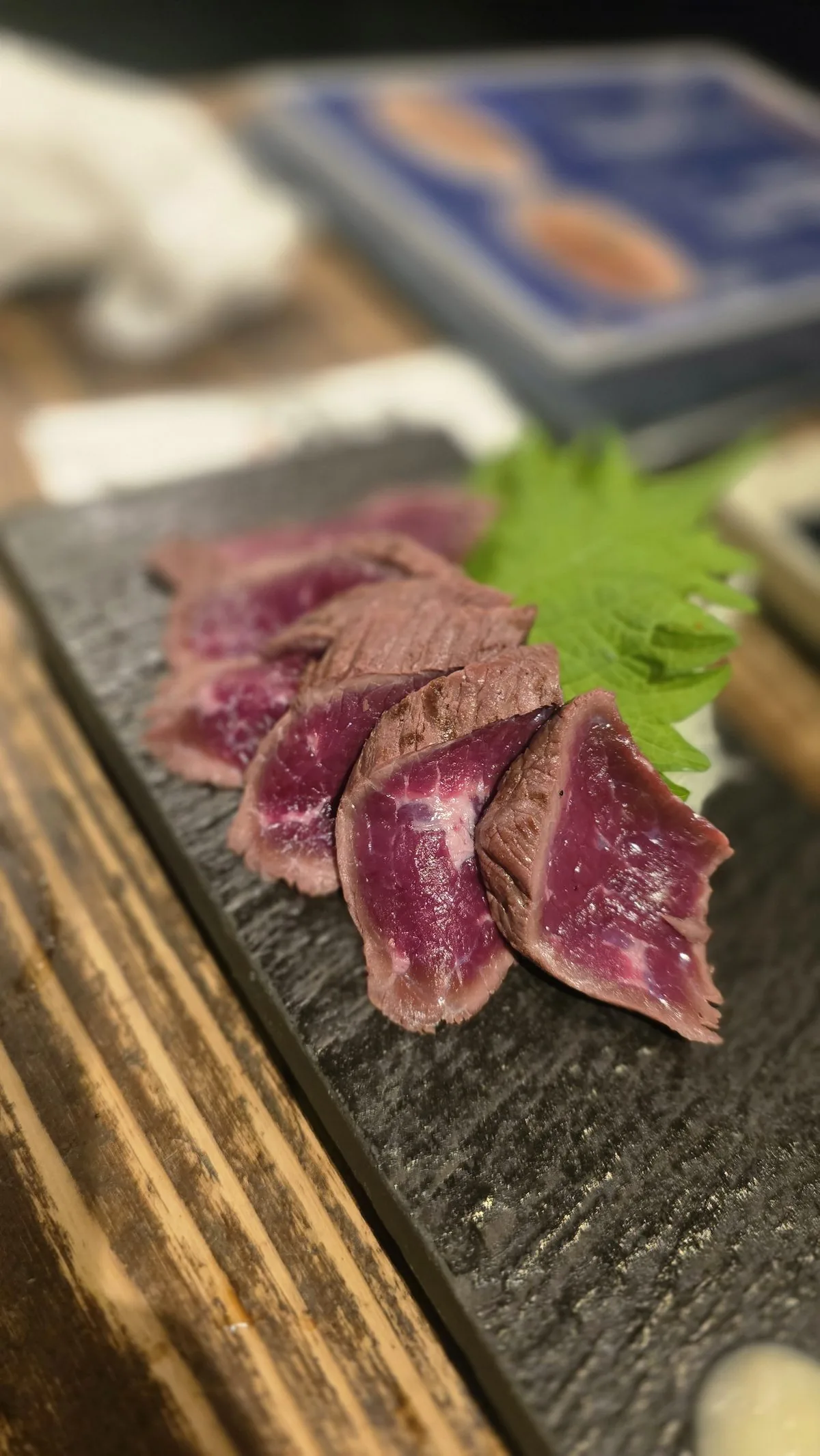 Tataki, seared and sliced, on slate
