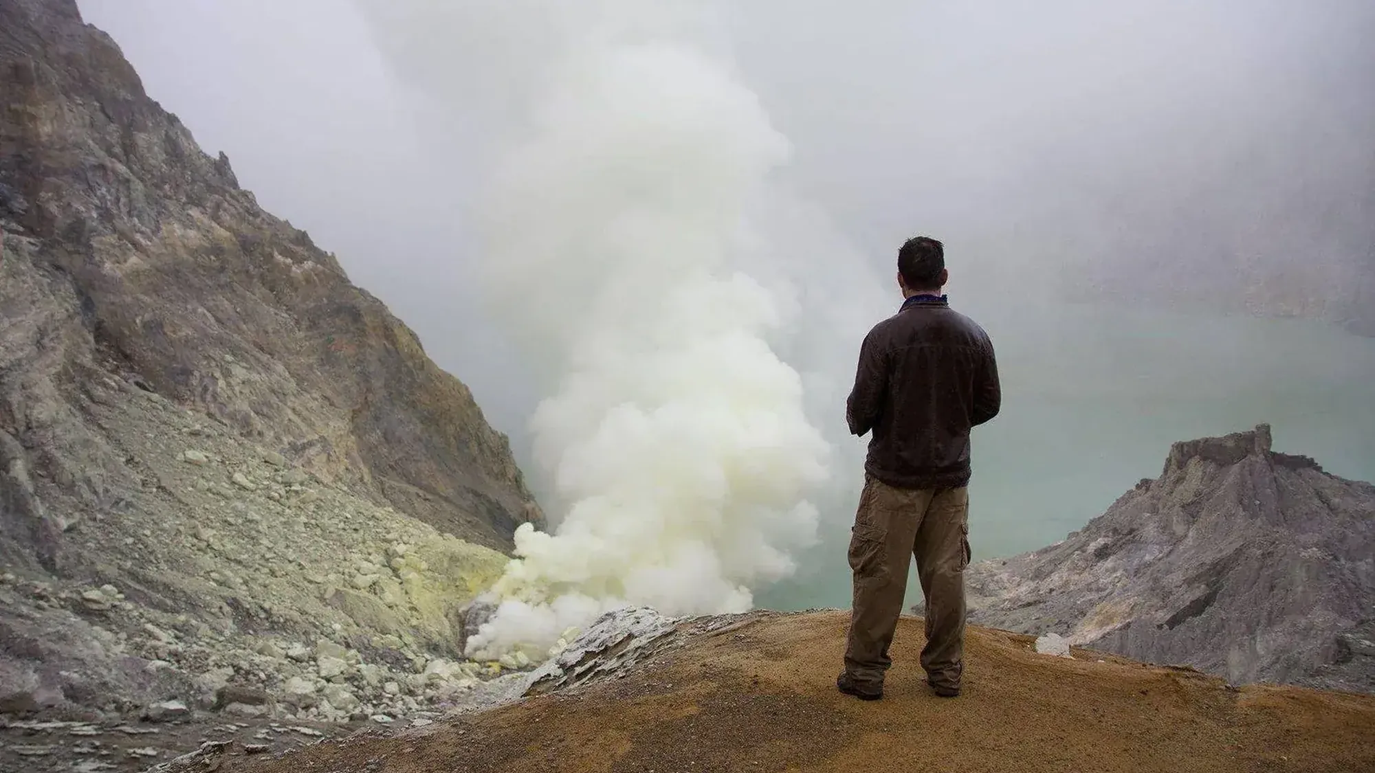 Jonathan Legg on the rim of Kawah Ijen, East Java — Road Less Traveled