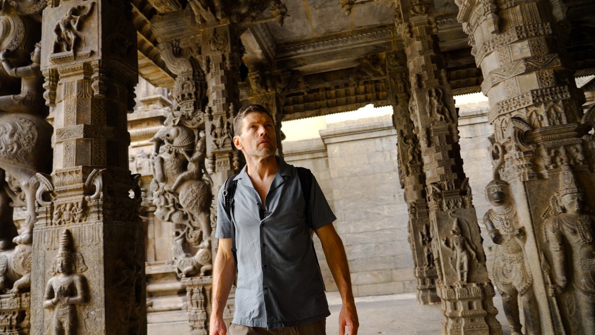 Jonathan Legg in a pillared hall, southern India